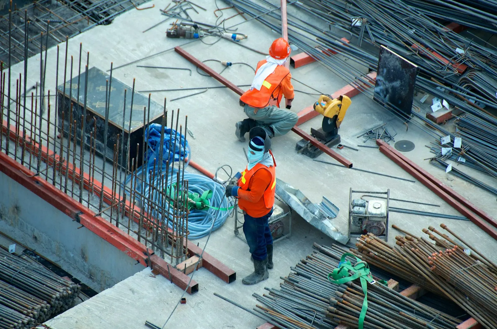 Roofer on a ladder performing a detailed roof inspection